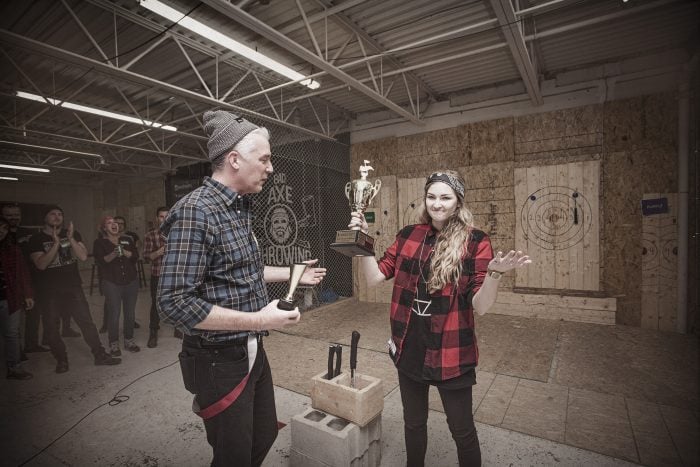 crowning an axe throwing champion during corporate event