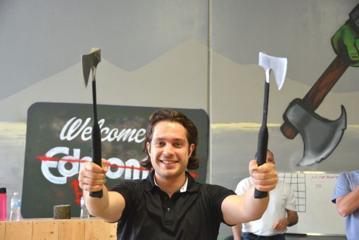 Holding axes at Bad Axe Throwing Edmonton